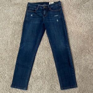 Skinny jeans with light distressing.